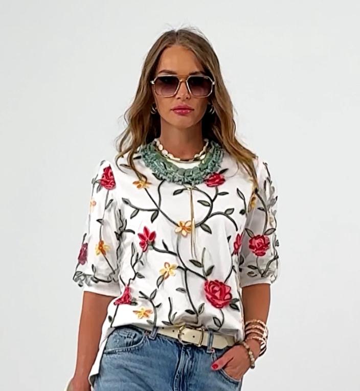 Elegant knit blouse with floral embroidery