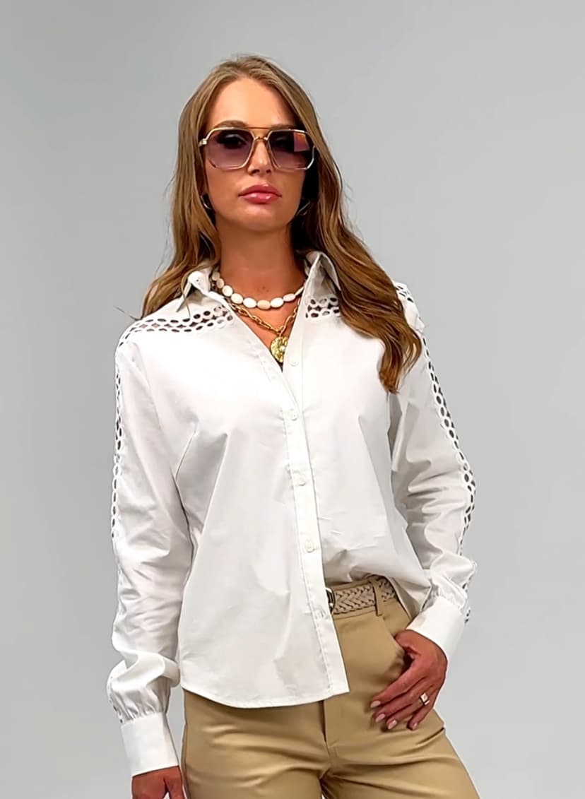 Elegant ivory blouse decorated with trim