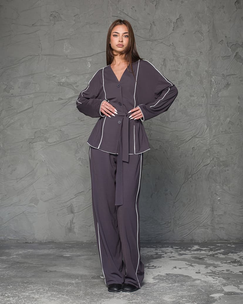  Knitted suit – jacket and trousers with piping